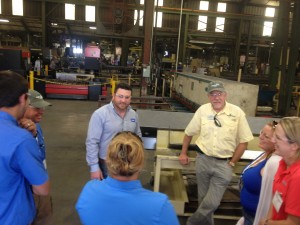 LMC employee giving attendees a tour of the manufacturing facilities.